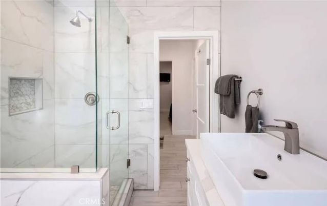 Bathroom, Glass Shower, Interior, Marble Walls, Wood Texture Flooring