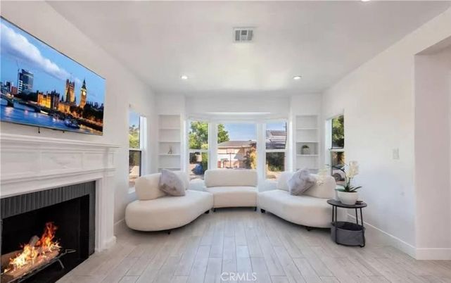 Fireplace, Interior, Living room, Recessed Lighting, Wood Texture Flooring