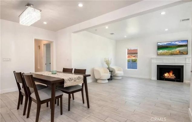 Chandelier, Dining room, Fireplace, Interior, Recessed Lighting, Wood Texture Flooring