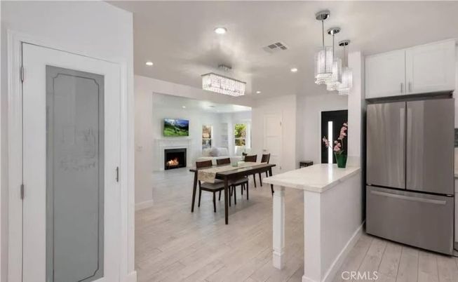 Chandelier, Dining room, Fireplace, Interior, Kitchen, Pendant Lights, Recessed Lighting, Wood Texture Flooring