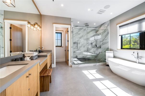 Bathroom, Dual Sink Vanities, Free Standing Baths, Glass Shower, Interior, Marble Walls, Recessed Lighting