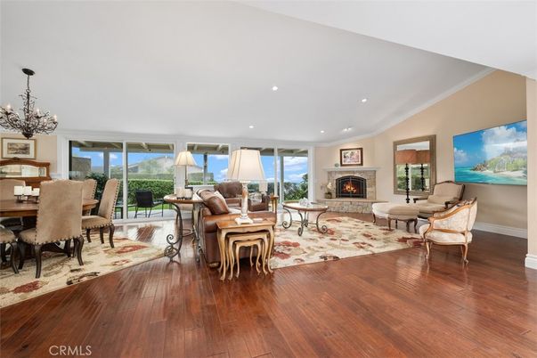 Chandelier, Dining room, Fireplace, Interior, Living room, Recessed Lighting, Wood Texture Flooring