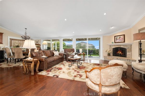 Dining room, Fireplace, Interior, Living room, Recessed Lighting, Wood Texture Flooring