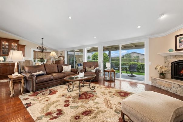 Chandelier, Fireplace, Interior, Living room, Recessed Lighting, Wood Texture Flooring