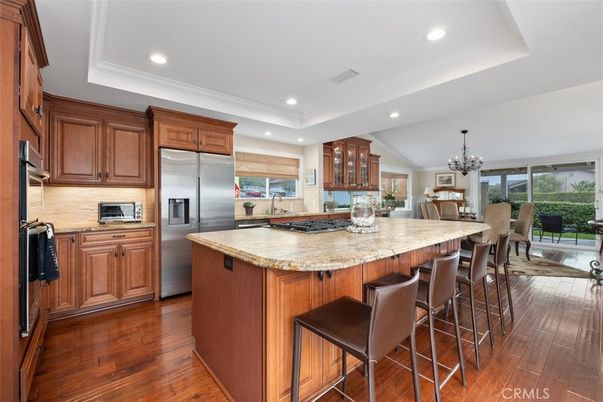 Chandelier, Dining room, Interior, Kitchen, Recessed Lighting, Stainless Steel Appliances, Wood Texture Flooring