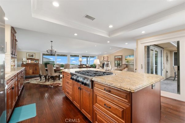 Chandelier, Dining room, Interior, Kitchen, Recessed Lighting, Stainless Steel Appliances, Water, Wood Texture Flooring