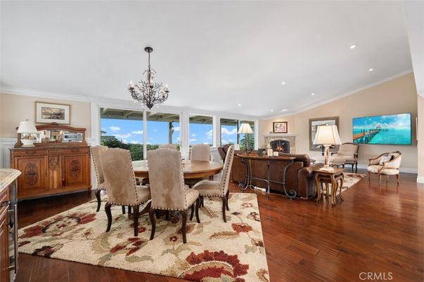 Chandelier, Dining room, Fireplace, Interior, Living room, Recessed Lighting, Wood Texture Flooring
