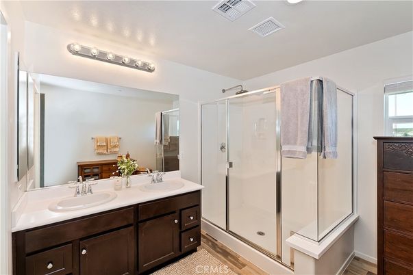 Bathroom, Dual Sink Vanities, Glass Shower, Interior, Wood Texture Flooring