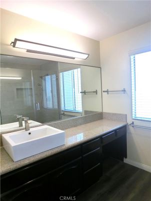 Bathroom, Dual Sink Vanities, Glass Shower, Interior, Wood Texture Flooring