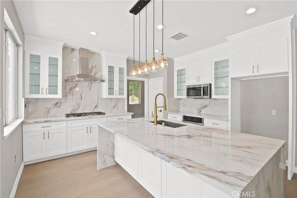 Interior, Kitchen, Marble Walls, Pendant Lights, Recessed Lighting, Stainless Steel Appliances, Wood Texture Flooring