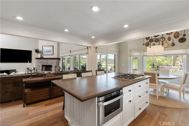 Dining room, Fireplace, Interior, Kitchen, Recessed Lighting, Wood Texture Flooring