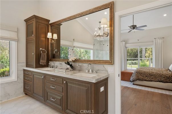 Bathroom, Chandelier, Dual Sink Vanities, Interior, Recessed Lighting, Wood Texture Flooring