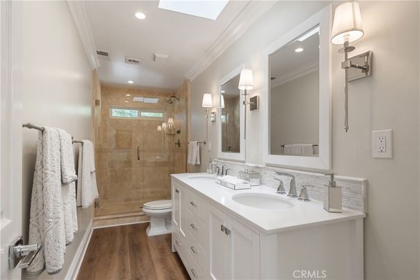 Bathroom, Dual Sink Vanities, Glass Shower, Interior, Recessed Lighting, Wood Texture Flooring