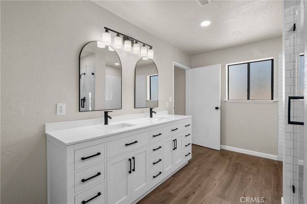 Bathroom, Dual Sink Vanities, Interior, Recessed Lighting, Wood Texture Flooring