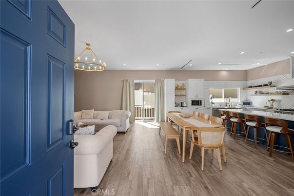 Chandelier, Dining room, Interior, Kitchen, Living room, Pendant Lights, Recessed Lighting, Stainless Steel Appliances, Wood Texture Flooring