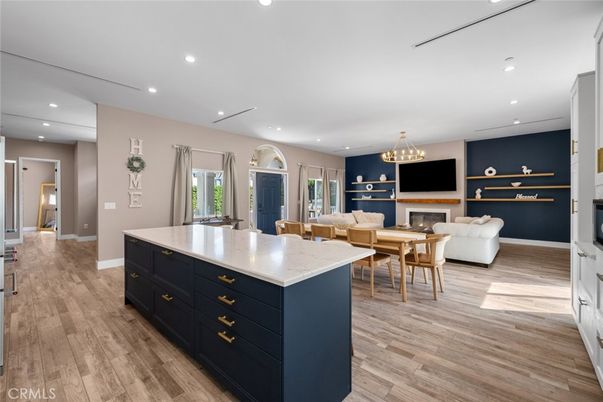 Chandelier, Dining room, Fireplace, Interior, Living room, Recessed Lighting, Wood Texture Flooring