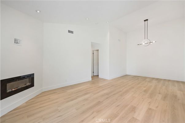 Empty room, Fireplace, Interior, Pendant Lights, Recessed Lighting, Wood Texture Flooring