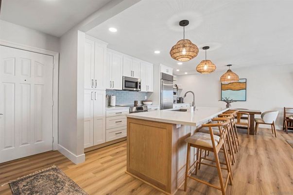 Dining room, Interior, Kitchen, Pendant Lights, Recessed Lighting, Stainless Steel Appliances, Wood Texture Flooring