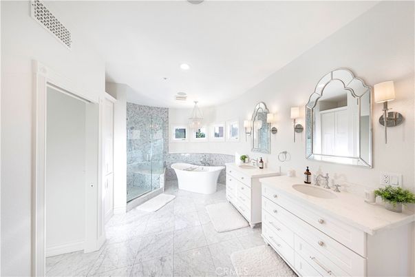 Bathroom, Chandelier, Dual Sink Vanities, Free Standing Baths, Glass Shower, Interior, Marble, Marble Walls, Recessed Lighting