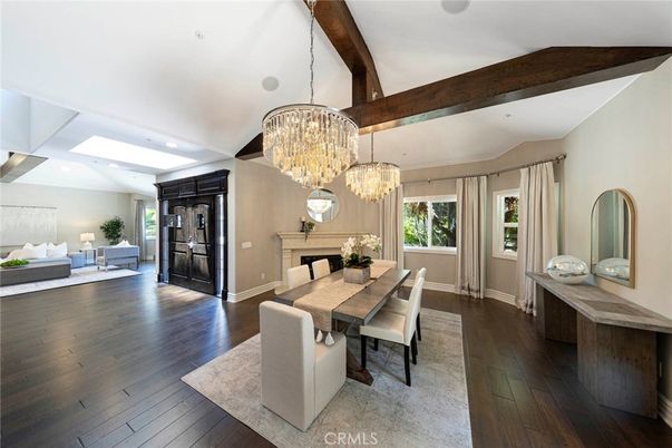 Chandelier, Dining room, Fireplace, Interior, Living room, Recessed Lighting, Wooden Beams, Wood Texture Flooring