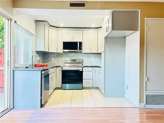 Interior, Kitchen, Recessed Lighting, Stainless Steel Appliances, Wood Texture Flooring
