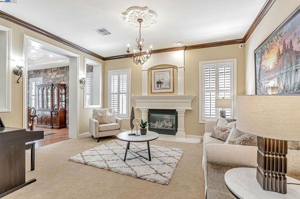 Chandelier, Fireplace, Interior, Living room, Recessed Lighting, Stone Walls, Wood Texture Flooring