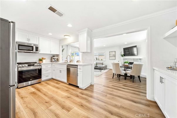 Dining room, Interior, Kitchen, Recessed Lighting, Stainless Steel Appliances, Wood Texture Flooring