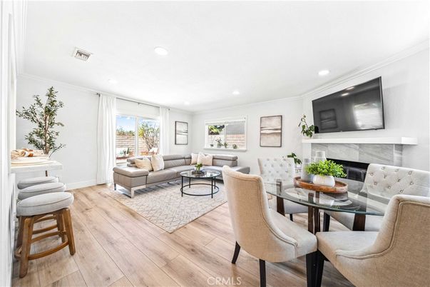 Dining room, Fireplace, Interior, Living room, Recessed Lighting, Wood Texture Flooring