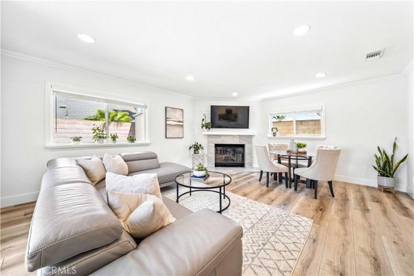 Dining room, Fireplace, Interior, Living room, Recessed Lighting, Wood Texture Flooring