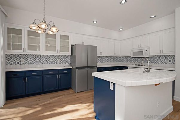 Interior, Kitchen, Pendant Lights, Recessed Lighting, Tile Countertops, Wood Texture Flooring