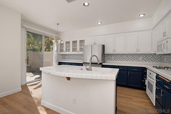 Interior, Kitchen, Pendant Lights, Recessed Lighting, Tile Countertops, Wood Texture Flooring