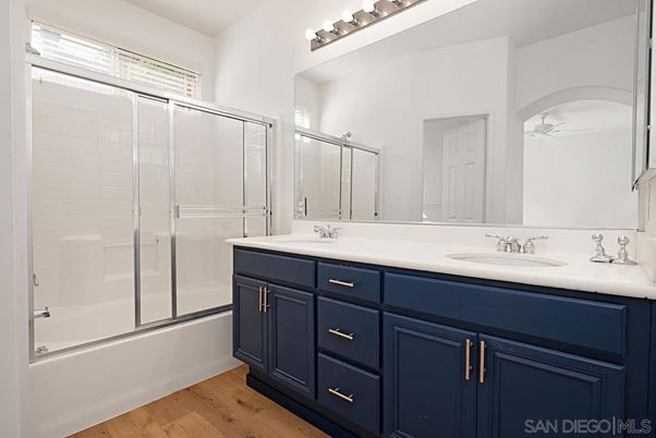 Bathroom, Dual Sink Vanities, Glass Shower, Interior, Wood Texture Flooring