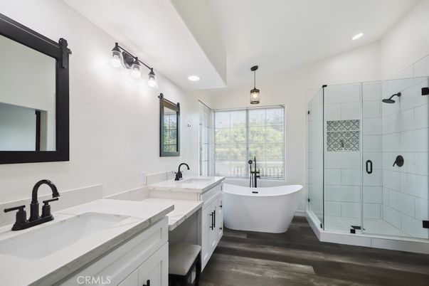 Bathroom, Dual Sink Vanities, Free Standing Baths, Glass Shower, Interior, Pendant Lights, Recessed Lighting, Wood Texture Flooring