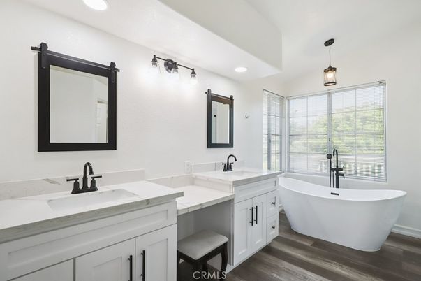 Bathroom, Dual Sink Vanities, Free Standing Baths, Interior, Pendant Lights, Recessed Lighting, Wood Texture Flooring