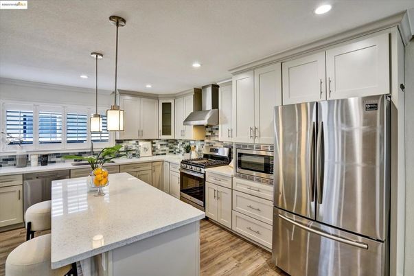 Interior, Kitchen, Pendant Lights, Recessed Lighting, Stainless Steel Appliances, Wood Texture Flooring