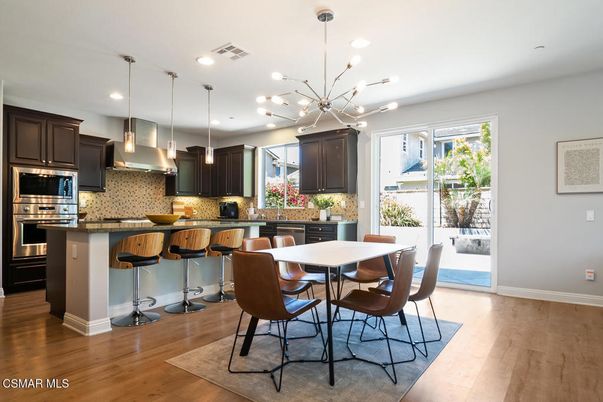 Dining room, Interior, Kitchen, Pendant Lights, Recessed Lighting, Stainless Steel Appliances, Wood Texture Flooring