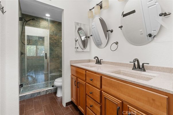 Bathroom, Dual Sink Vanities, Glass Shower, Interior, Recessed Lighting, Wood Texture Flooring