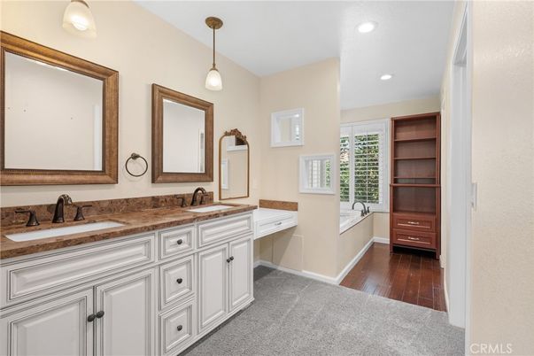 Bathroom, Dual Sink Vanities, Interior, Pendant Lights, Recessed Lighting, Wood Texture Flooring