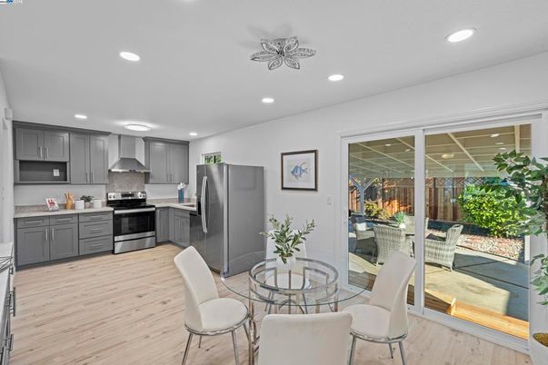 Dining room, Interior, Kitchen, Recessed Lighting, Stainless Steel Appliances, Wood Texture Flooring