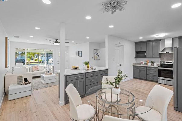 Dining room, Interior, Kitchen, Living room, Recessed Lighting, Stainless Steel Appliances, Wood Texture Flooring