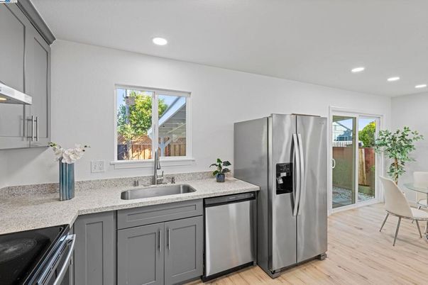 Dining room, Interior, Kitchen, Recessed Lighting, Stainless Steel Appliances, Wood Texture Flooring