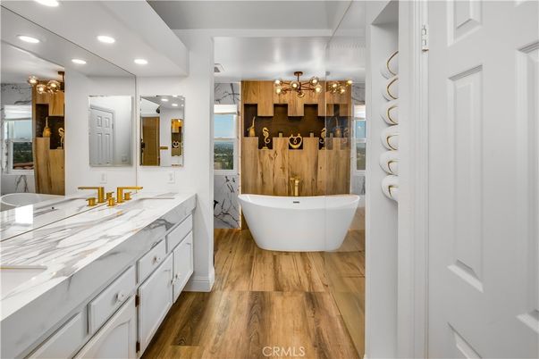 Bathroom, Dual Sink Vanities, Free Standing Baths, Interior, Recessed Lighting, Wood Texture Flooring