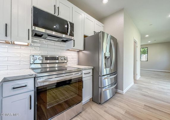Interior, Kitchen, Recessed Lighting, Stainless Steel Appliances, Wood Texture Flooring