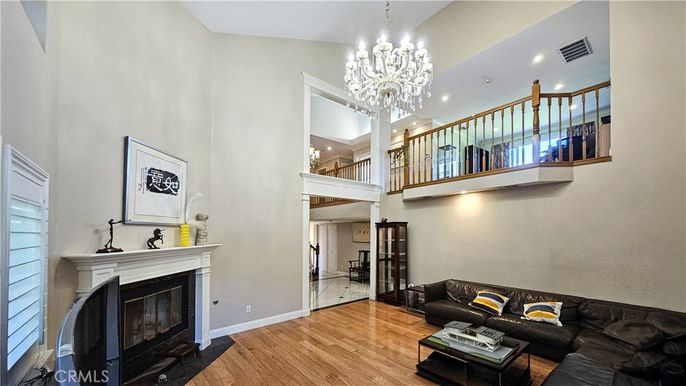 Chandelier, Fireplace, Interior, Living room, Recessed Lighting, Wood Texture Flooring
