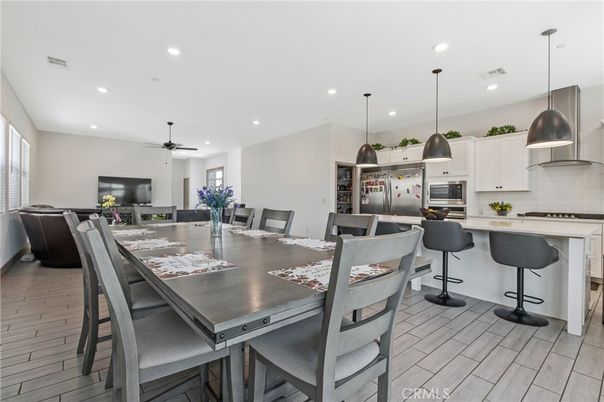 Dining room, Interior, Kitchen, Pendant Lights, Recessed Lighting, Stainless Steel Appliances, Wood Texture Flooring
