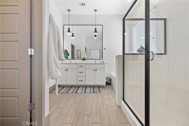 Bathroom, Dual Sink Vanities, Glass Shower, Interior, Pendant Lights, Wood Texture Flooring