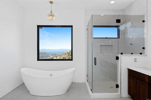 Bathroom, Free Standing Baths, Glass Shower, Interior, Marble, Marble Walls, Pendant Lights, Recessed Lighting