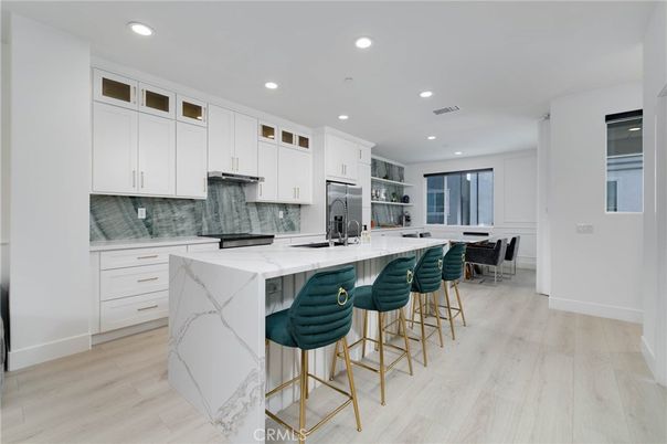 Interior, Kitchen, Marble Walls, Recessed Lighting, Stainless Steel Appliances, Wood Texture Flooring