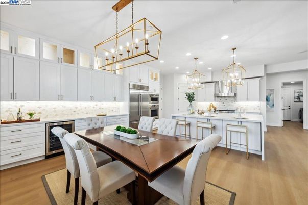 Dining room, Interior, Kitchen, Pendant Lights, Recessed Lighting, Stainless Steel Appliances, Wood Texture Flooring