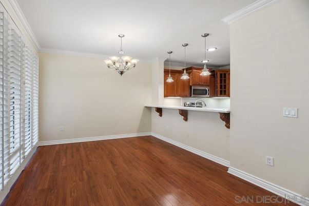 Chandelier, Empty room, Interior, Kitchen, Pendant Lights, Stainless Steel Appliances, Wood Texture Flooring